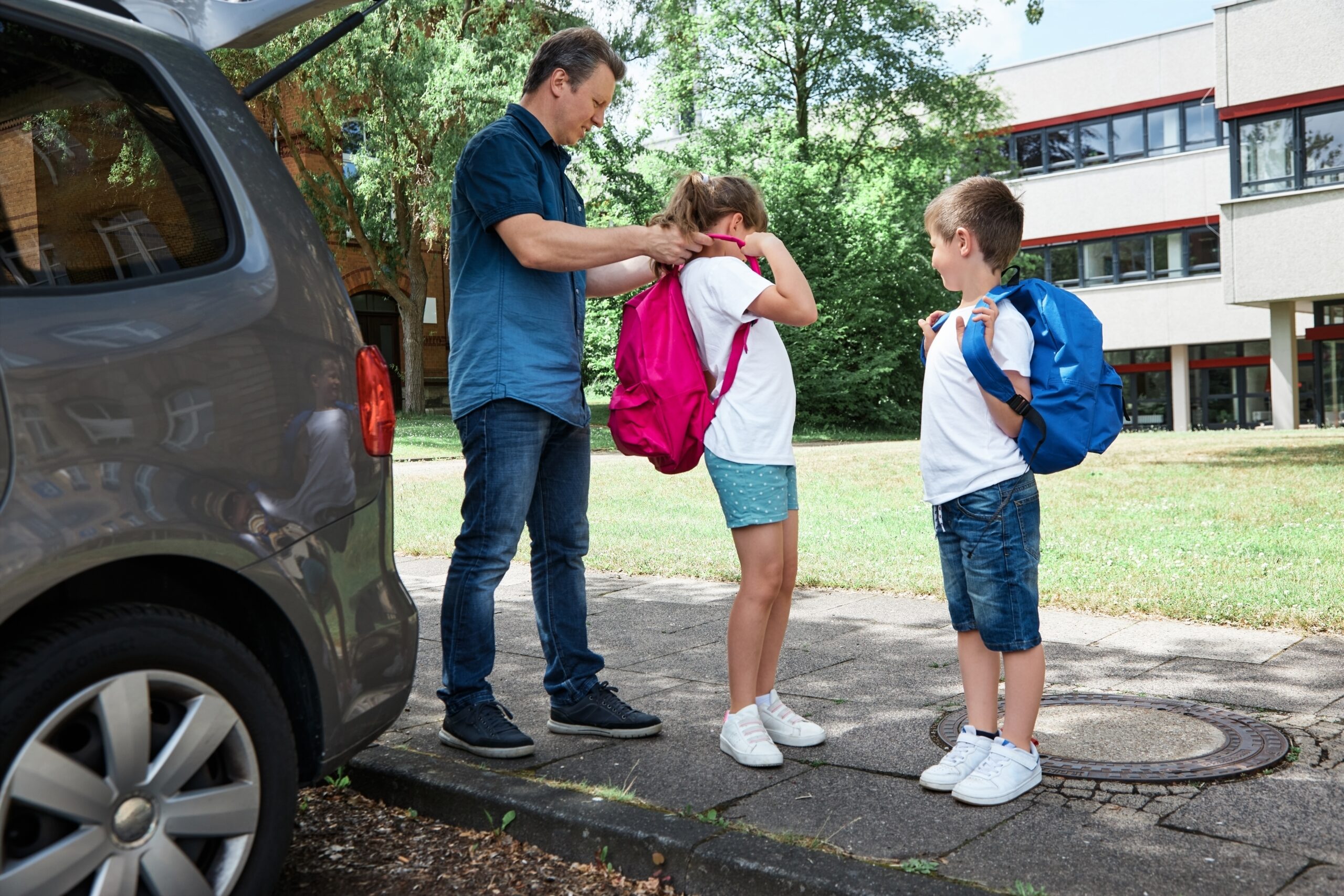 Dad and children getting ready for back-to-school driving in Leamington Ontario